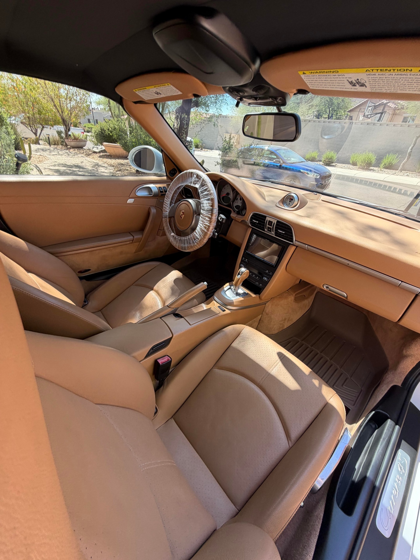 Spotless tan leather Porsche interior after detail